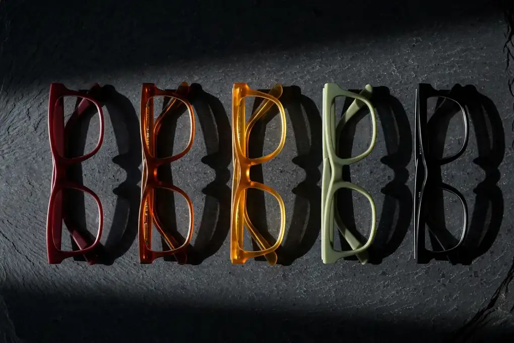 Flat lay of 2026 frames in oxblood, cognac and mineral green